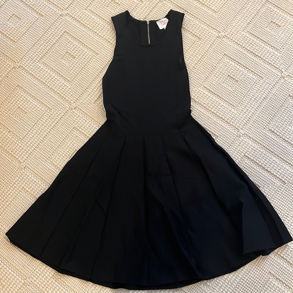 Black Parker dress with key hold detail on back.